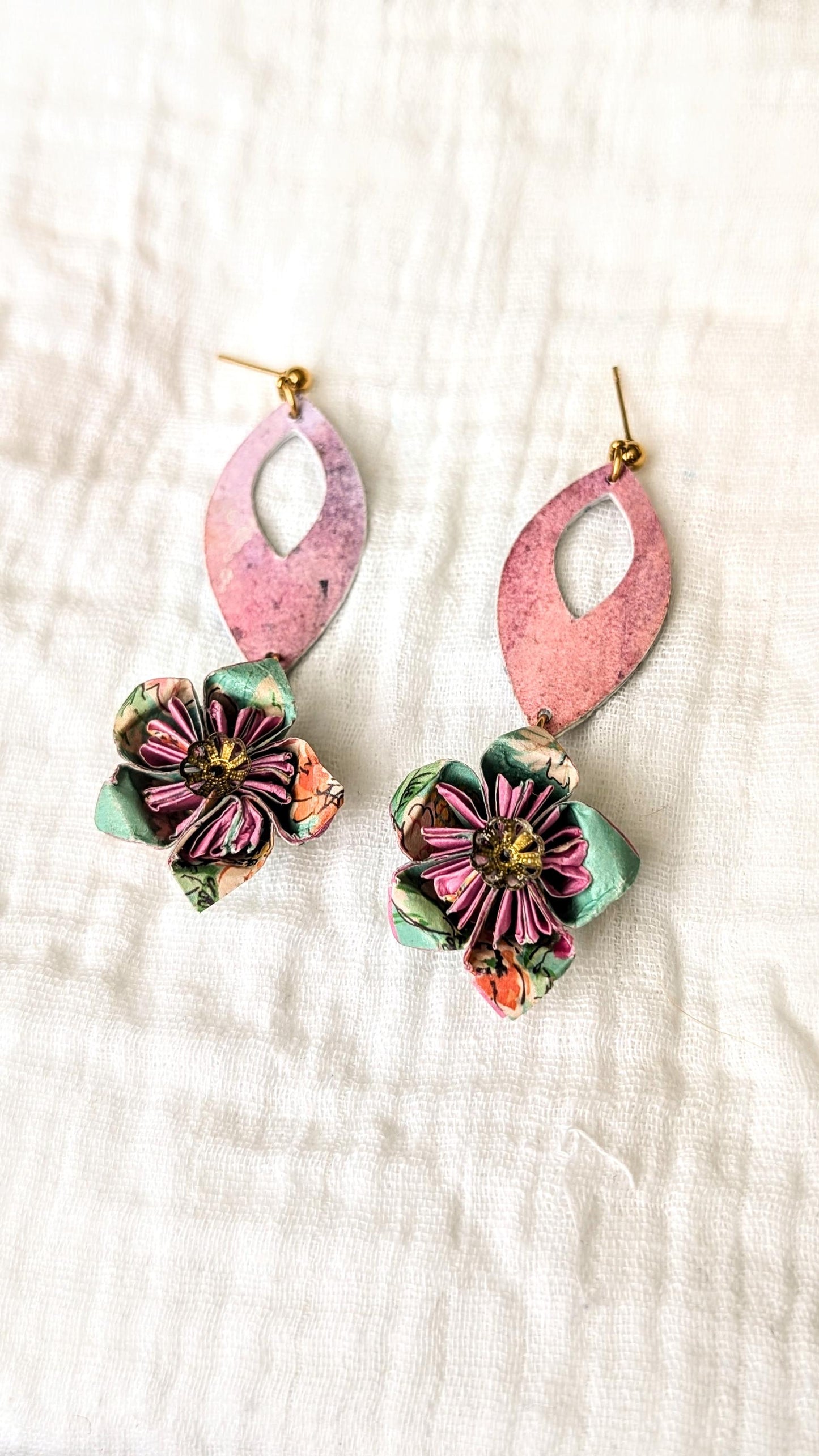 Handcrafted origami flower earrings made from hand-painted watercolour paper in soft pastel tones. Each flower is delicately folded and paired with upcycled bead accents, suspended from surgical steel hooks.
