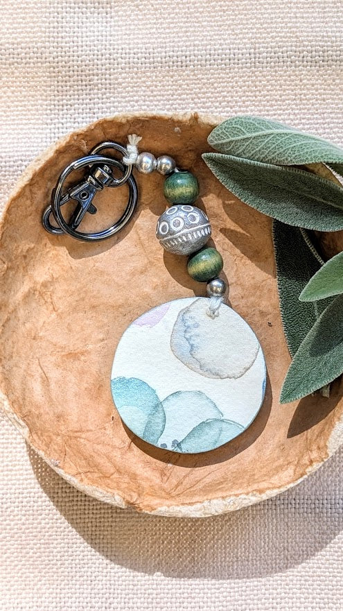 Green beaded keyring with watercolour flowers