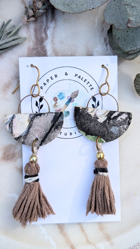 Hand-painted watercolour paper earrings with abstract earthy patterns, cotton tassels, and gold-toned hooks. Handmade in Australia – Mariposa Collection