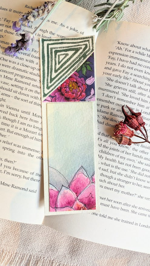 Nature-inspired bookmark with green spiral brushwork and layered floral collage, painted on recycled paper