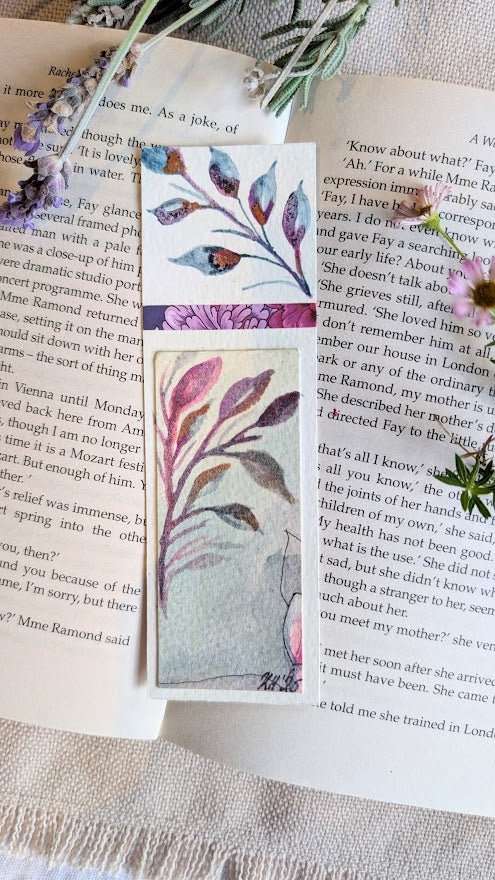Eco-friendly bookmark with soft purple hues and hand-painted leafy branches