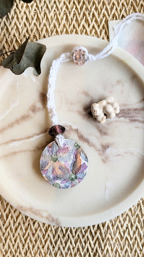 floral pendant on a marble surface