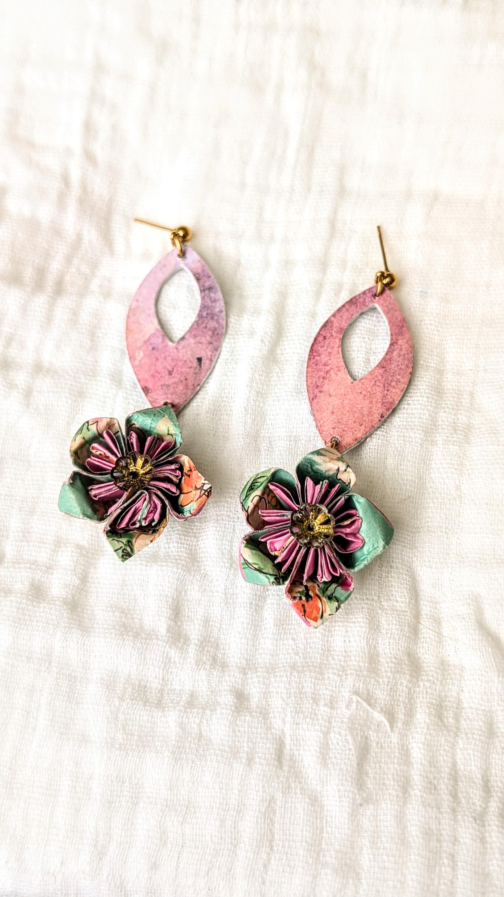 Handcrafted origami flower earrings made from hand-painted watercolour paper in soft pastel tones. Each flower is delicately folded and paired with upcycled bead accents, suspended from surgical steel hooks.